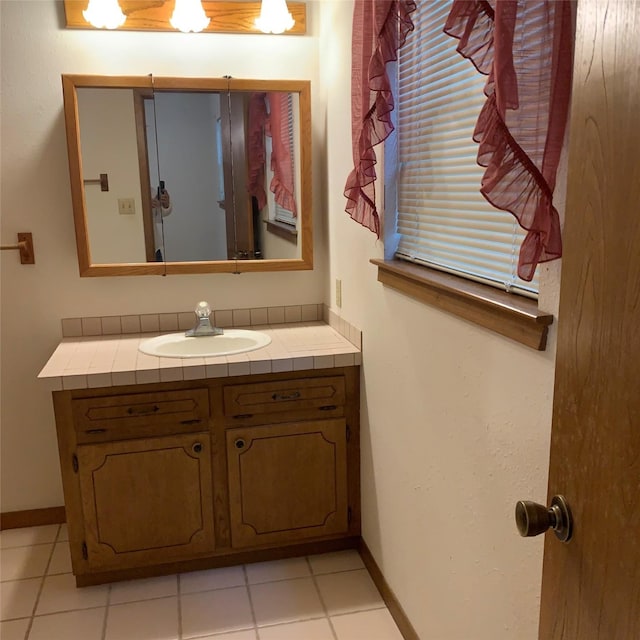 169 Lakeview Pnes, Livingston, TX 77351 - bathroom with vanity, tile patterned floors, and baseboards