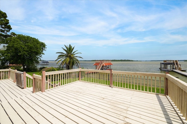 wooden terrace featuring a water view