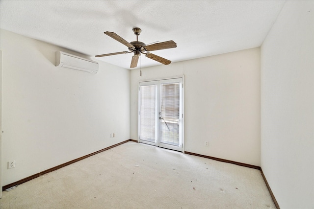 empty room with an AC wall unit, baseboards, a ceiling fan, and carpet