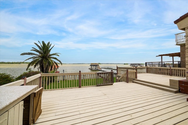 wooden deck with a water view
