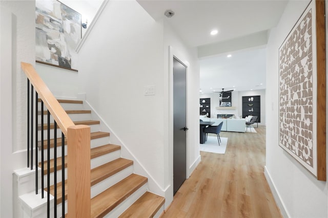 5510 Harvest Oak Landing Dr, Spring, TX 77386 - hall with recessed lighting, baseboards, stairs, and wood finished floors