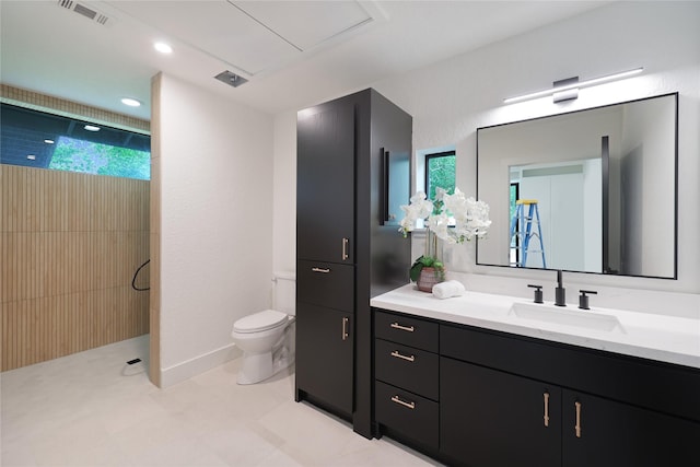 bathroom with visible vents, vanity, toilet, recessed lighting, and a walk in shower