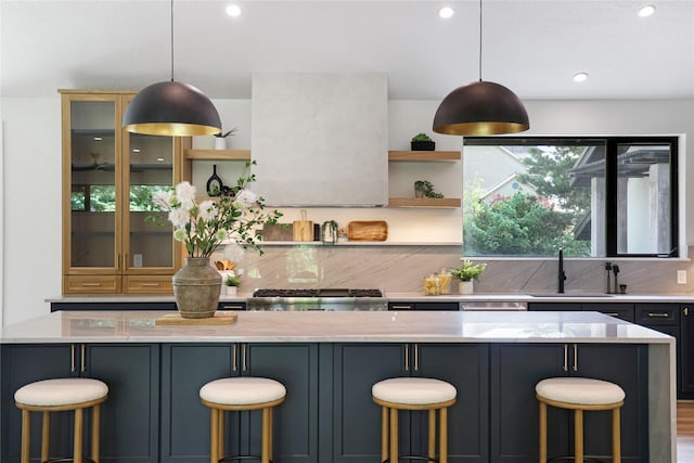 kitchen with decorative backsplash, range, open shelves, a sink, and recessed lighting
