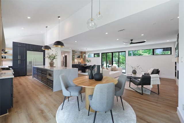 dining space with recessed lighting, visible vents, and light wood-style flooring