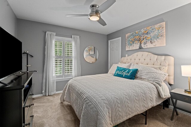 bedroom featuring baseboards, a ceiling fan, and carpet flooring