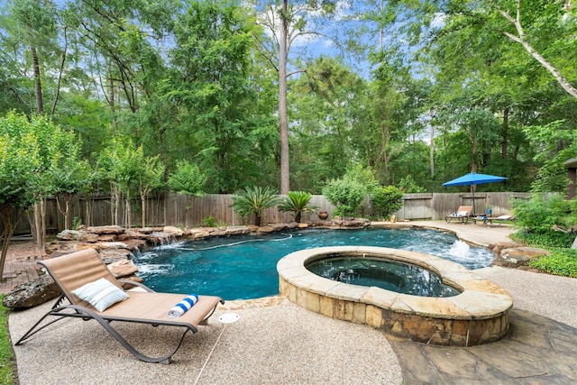 view of pool featuring a patio, an in ground hot tub, a fenced in pool, and a fenced backyard