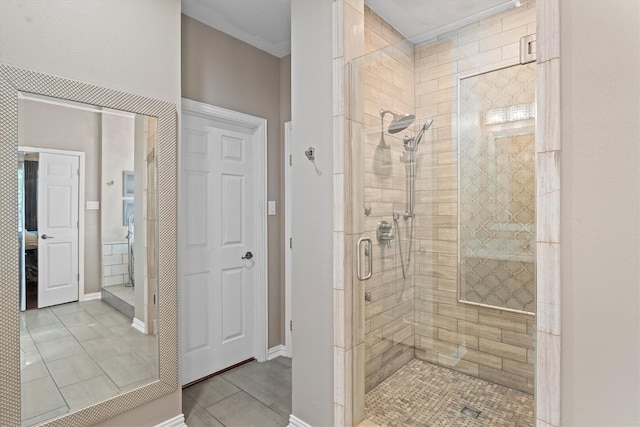 bathroom featuring tile patterned floors and a stall shower