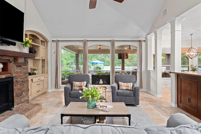living room featuring visible vents, baseboards, high vaulted ceiling, ornate columns, and a ceiling fan