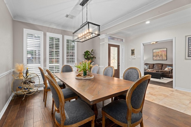 dining room featuring crown molding, visible vents, baseboards, recessed lighting, and dark wood finished floors