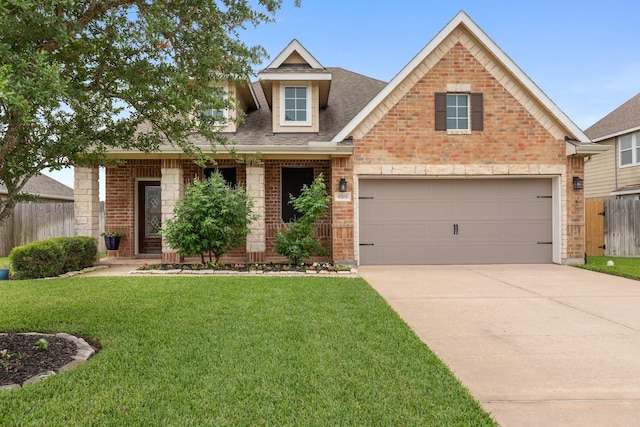 view of front of property with brick siding, fence, driveway, and a front lawn
