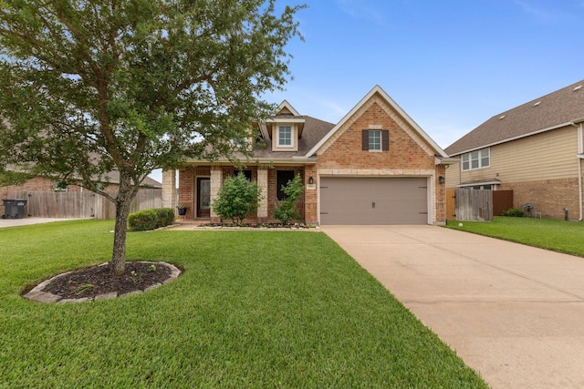 view of front facade with brick siding, fence, and concrete driveway
