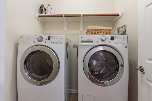 laundry area with laundry area and washer and clothes dryer