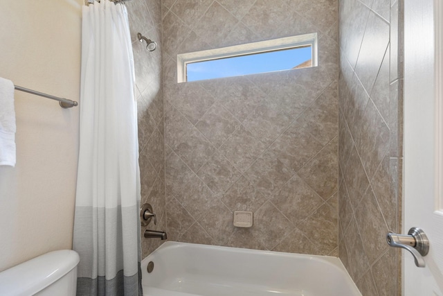 full bath featuring toilet and shower / tub combo with curtain