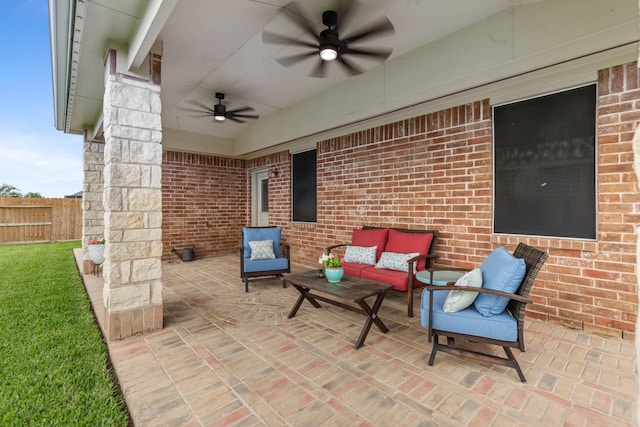 view of patio featuring fence, ceiling fan, and an outdoor living space