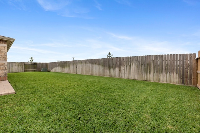 view of yard featuring a fenced backyard