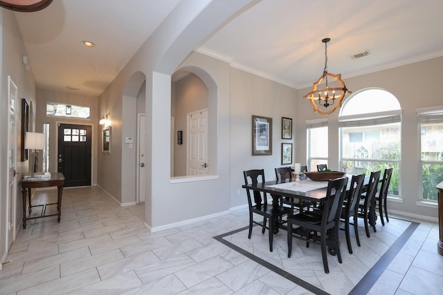 dining area featuring a chandelier, baseboards, recessed lighting, and arched walkways