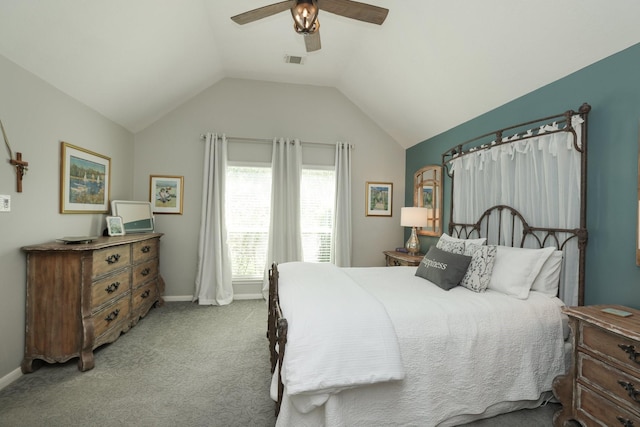 bedroom featuring baseboards, carpet flooring, lofted ceiling, and ceiling fan