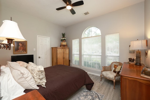 bedroom with light wood-style floors and ceiling fan