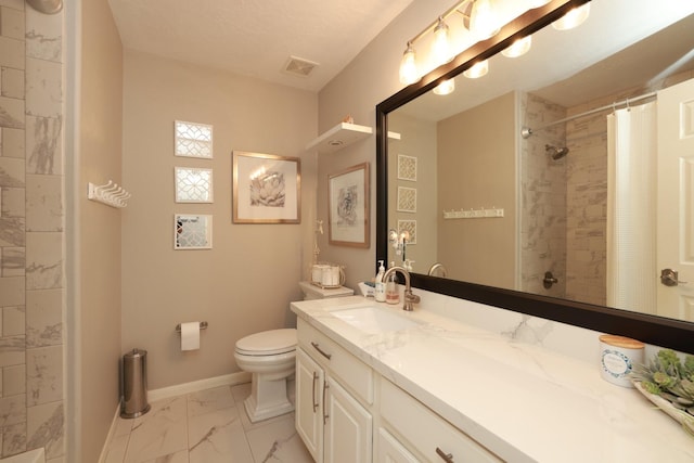 bathroom with marble finish flooring, tiled shower, toilet, baseboards, and vanity