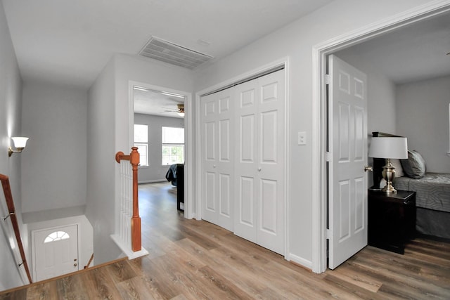 8102 Rhobell St, Houston, TX 77078 - foyer featuring a ceiling fan, baseboards, visible vents, and light wood-style flooring