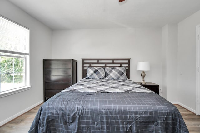 8102 Rhobell St, Houston, TX 77078 - bedroom featuring baseboards and wood finished floors