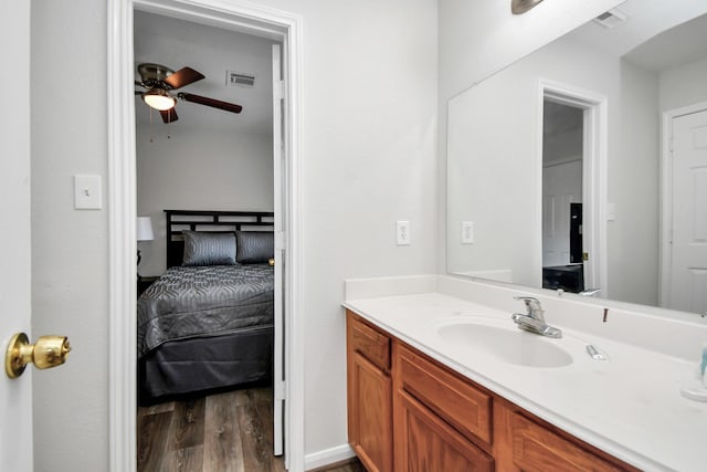 8102 Rhobell St, Houston, TX 77078 - ensuite bathroom featuring vanity, ceiling fan, wood finished floors, and visible vents