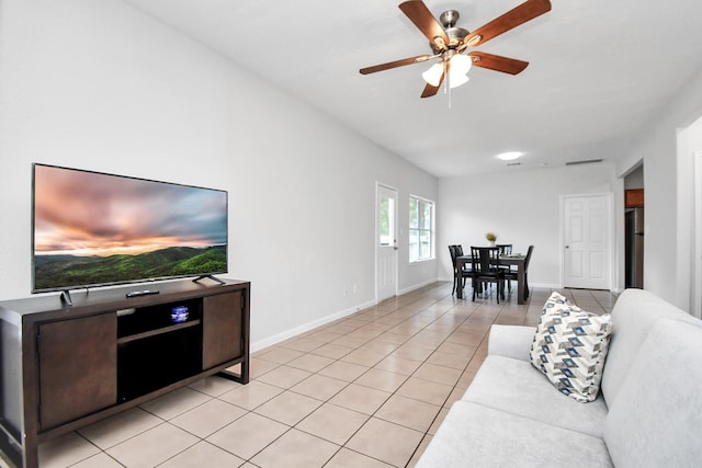 8102 Rhobell St, Houston, TX 77078 - living room featuring baseboards, ceiling fan, and light tile patterned floors