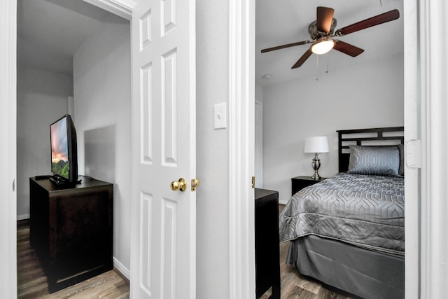 8102 Rhobell St, Houston, TX 77078 - bedroom featuring baseboards, ceiling fan, and wood finished floors