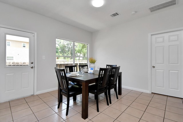8102 Rhobell St, Houston, TX 77078 - dining space featuring visible vents, baseboards, and light tile patterned flooring