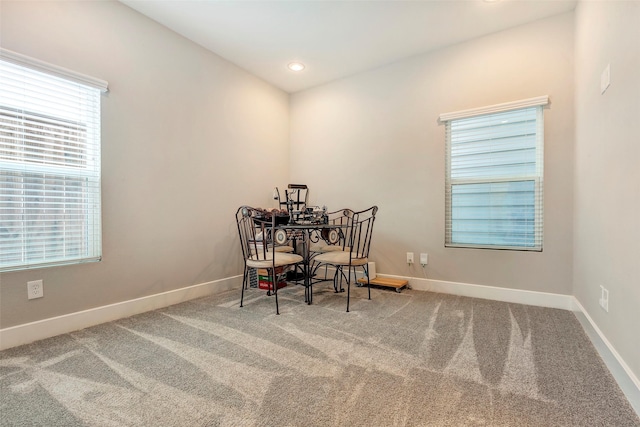 carpeted dining room featuring baseboards and recessed lighting