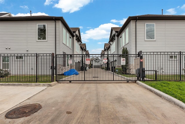 view of gate with fence