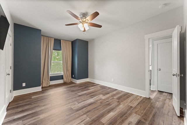 26111 Upper Beacon Pl, Montgomery, TX 77316 - spare room featuring baseboards, a ceiling fan, and wood finished floors