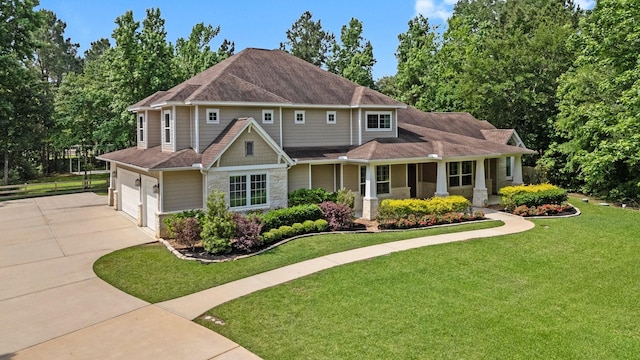 26111 Upper Beacon Pl, Montgomery, TX 77316 - traditional-style house featuring fence, an attached garage, a front lawn, stone siding, and concrete driveway