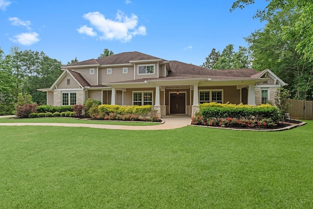 26111 Upper Beacon Pl, Montgomery, TX 77316 - view of front of home with a front yard and stone siding