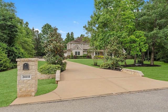 26111 Upper Beacon Pl, Montgomery, TX 77316 - view of front facade with a front lawn