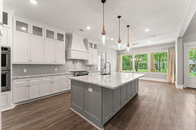 26111 Upper Beacon Pl, Montgomery, TX 77316 - kitchen featuring a sink, white cabinets, appliances with stainless steel finishes, and premium range hood