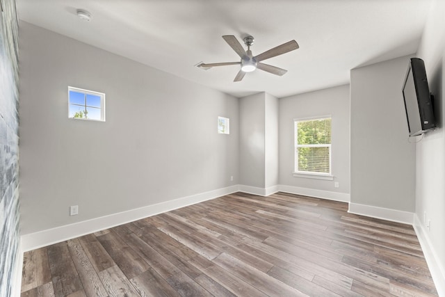 26111 Upper Beacon Pl, Montgomery, TX 77316 - spare room featuring a ceiling fan, baseboards, and wood finished floors