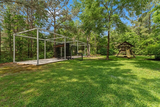 26111 Upper Beacon Pl, Montgomery, TX 77316 - view of yard with a patio area and a playground