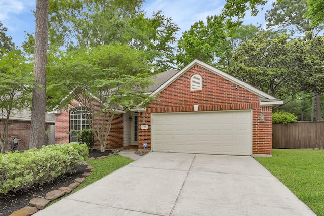 view of front of house with fence, an attached garage, brick siding, a front yard, and driveway