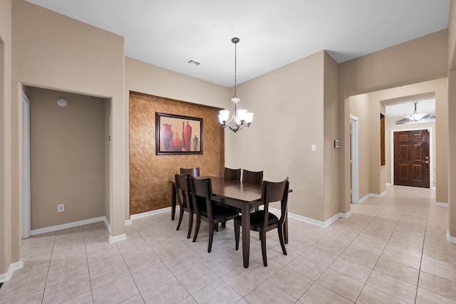 dining area with an inviting chandelier, light tile patterned floors, baseboards, and visible vents