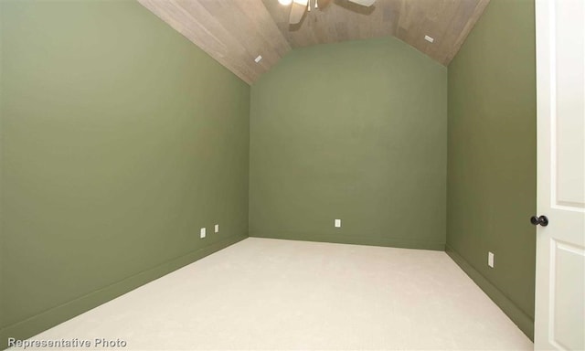 interior space featuring carpet floors, ceiling fan, and vaulted ceiling