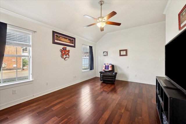 living area featuring dark wood-type flooring, a ceiling fan, lofted ceiling, and a wealth of natural light
