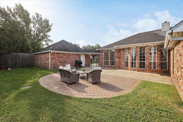 view of patio / terrace with area for grilling and fence