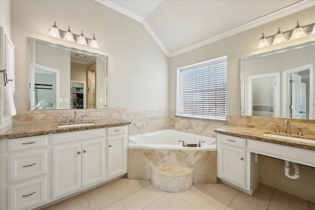 full bath with a bath, ornamental molding, a sink, and lofted ceiling