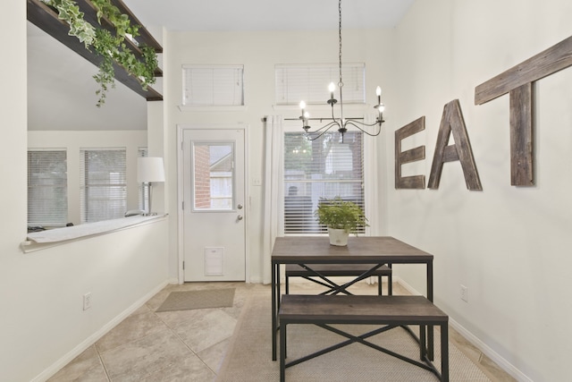 entryway featuring an inviting chandelier, light tile patterned floors, and baseboards