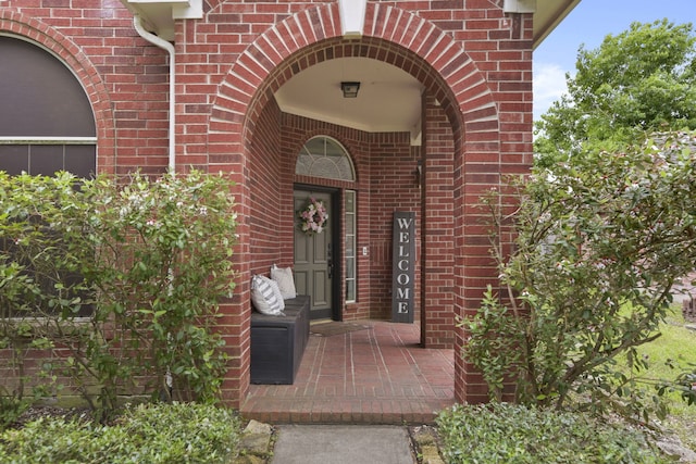 property entrance with brick siding