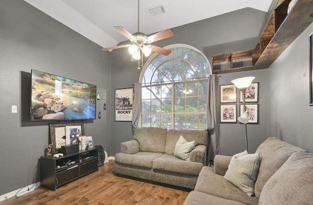 living area with a ceiling fan, baseboards, visible vents, and wood finished floors