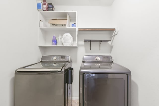 laundry room featuring independent washer and dryer and laundry area