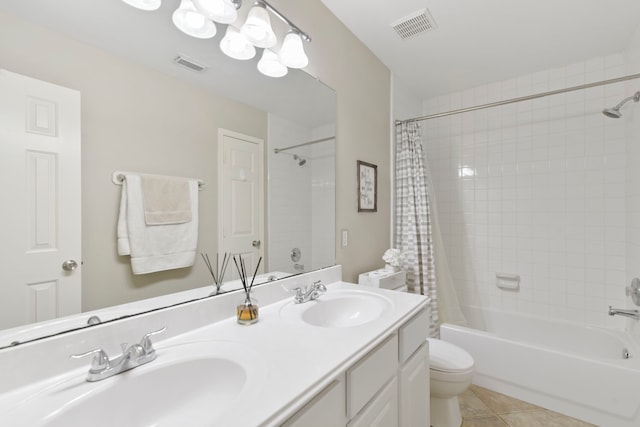 bathroom with visible vents, a sink, tile patterned floors, and shower / tub combo