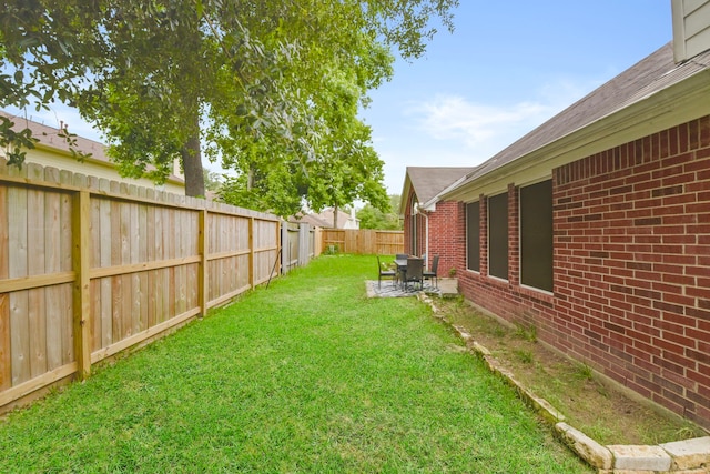 view of yard with a fenced backyard and a patio area